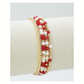 The FASHION GO Set of 4 Glass Bead and Gold Stretch Bracelets features alternating red and white beads—perfect for gameday to show off your team colors in style.