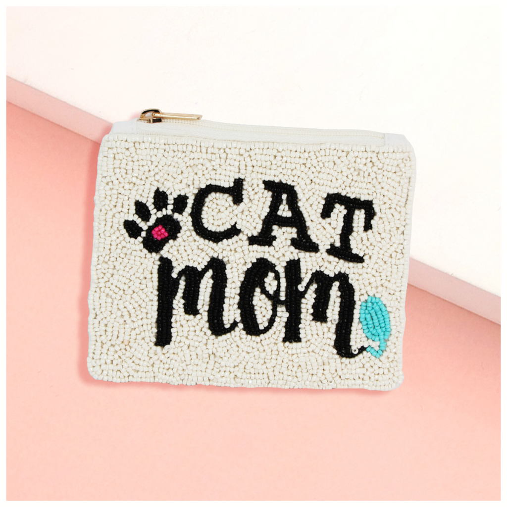 The Wona Trading Seed Bead Accented Mini Pouch Bag features "CAT mom" text, a cat paw graphic, and blue accents on a pink and white base—an adorable gift for any fashionista.