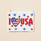 The Wona Trading Seed Bead Accented Mini Pouch Bag features “I ♥ USA” in red, a flag-patterned heart, and star-shaped red and blue bead accents—an ideal patriotic gift for any fashionista.