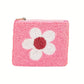 The Wona Trading Seed Bead Accented Mini Pouch Bag Assorted is a small pink zippered coin pouch with a white and red beaded flower on the front—an adorable gift item.