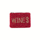 The Seed Bead Accented Mini Pouch Bag by Wona Trading is a rectangular red clutch featuring "WINES" in gold beads with the "S" as a dollar sign, perfect as a gift or stylish accessory.