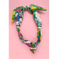 The FASHION GO Handmade Scarf Necklace in assorted colors and patterns is displayed on a light pink background.