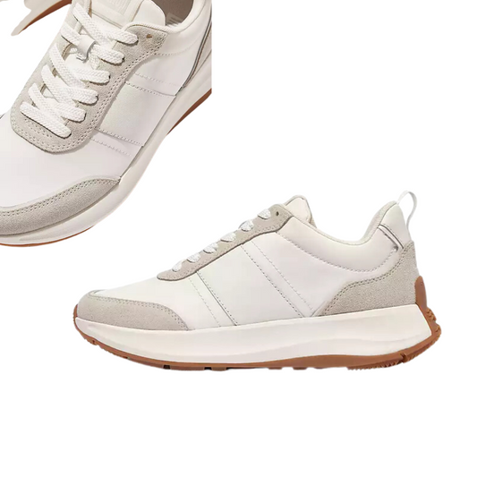 Introducing the F-MODE Flow Fabric/Suede/Leather Flatform Sneakers by FITFLOP USA LLC. This pair of white athletic shoes boasts beige accents and white laces, complemented by a textured white and beige sole designed for optimal traction, capturing a vintage runner aesthetic. One shoe is displayed from the side, while the other is shown from a top-down perspective.