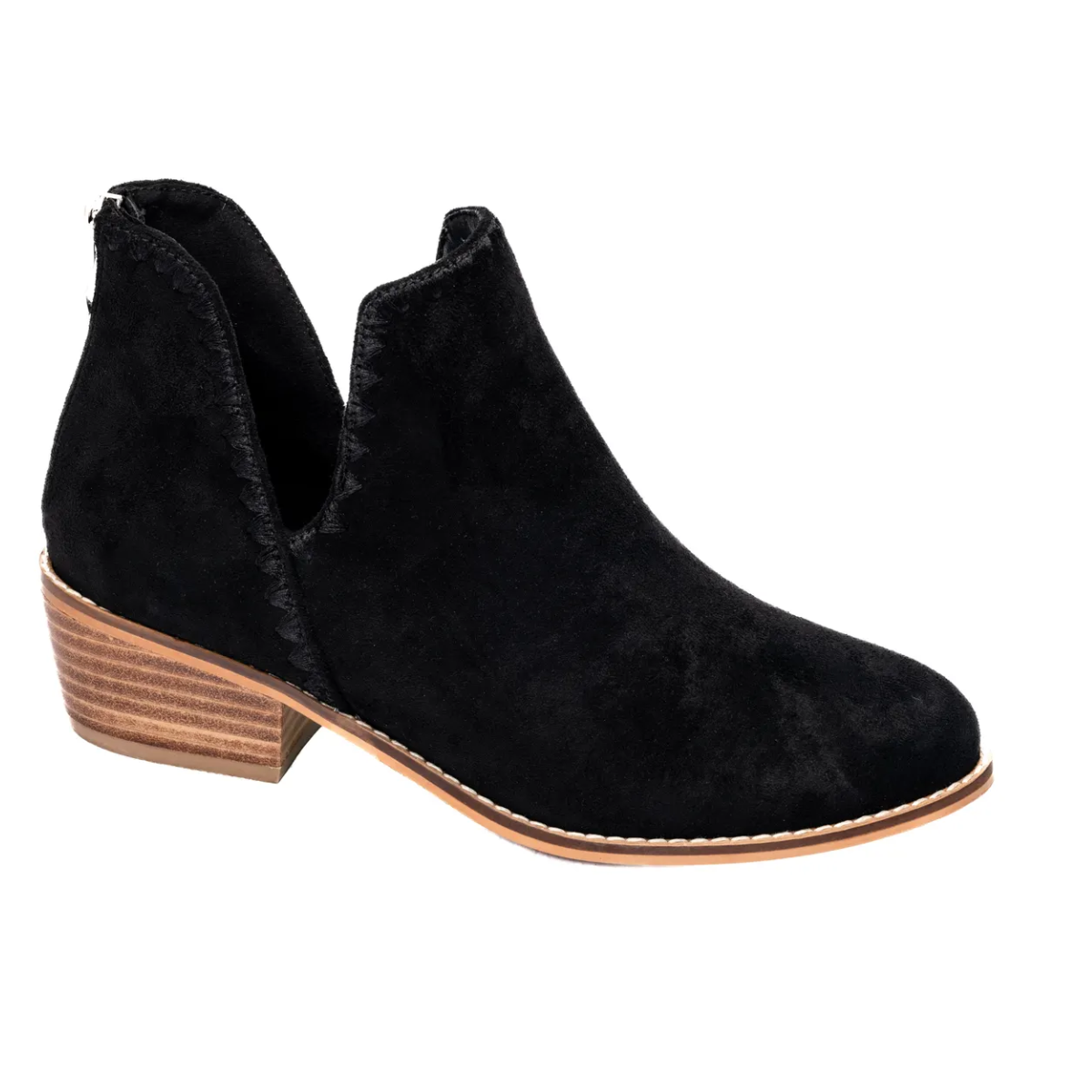 The Spice It Up Boot in Black by Corky's, a product from CORKY'S FOOTWEAR INC, features black suede with a 1-3/4" chunky wooden block heel and a side cut-out design, showcased against a plain white background.