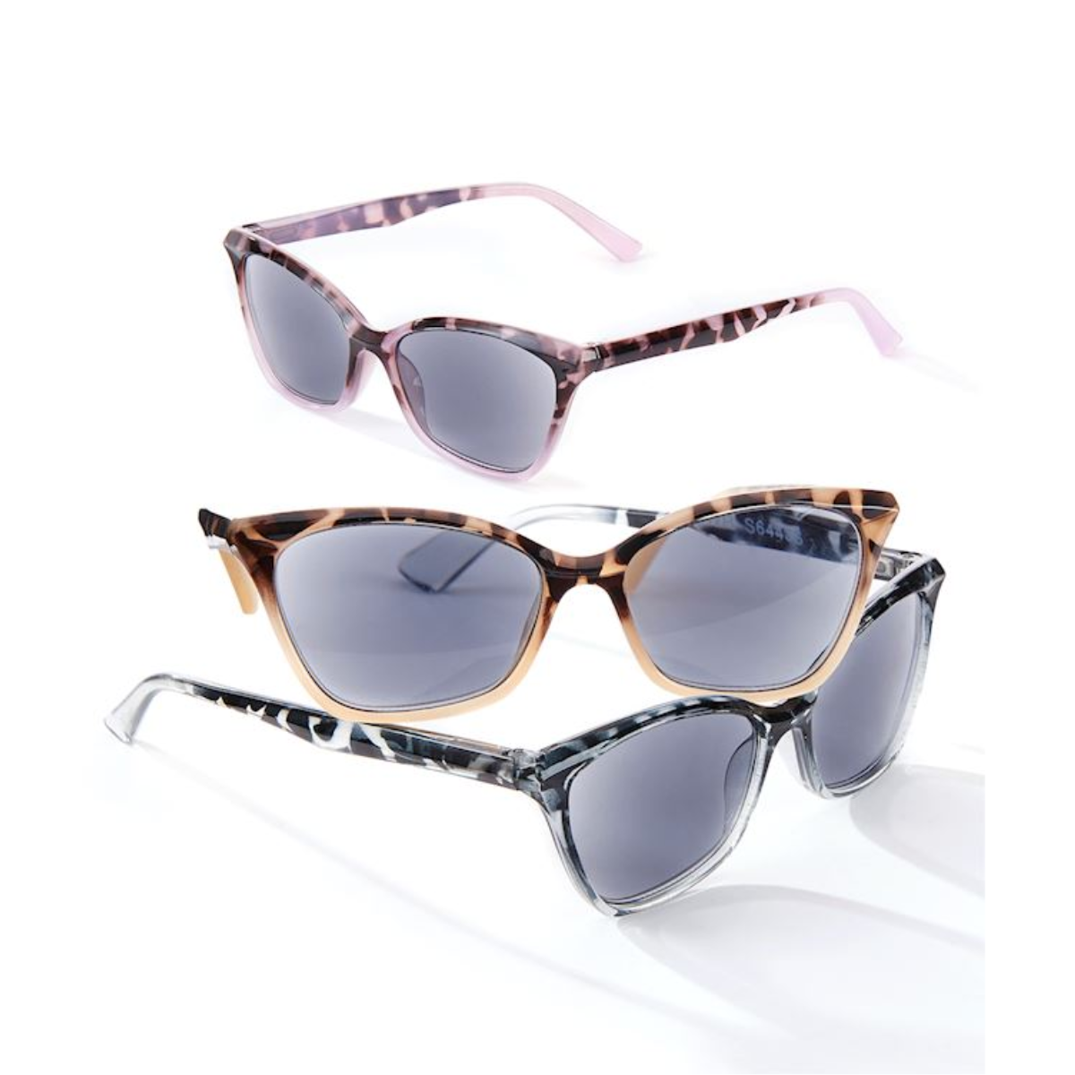 The Women's Sun Reader w/Pouch by GIFTCRAFT offers three pairs of sunglasses with patterned frames: one with pink accents, one with brown accents, and one with white and black accents. All feature spring hinges for enhanced comfort, making them perfect for those seeking stylish UV protection. Main image