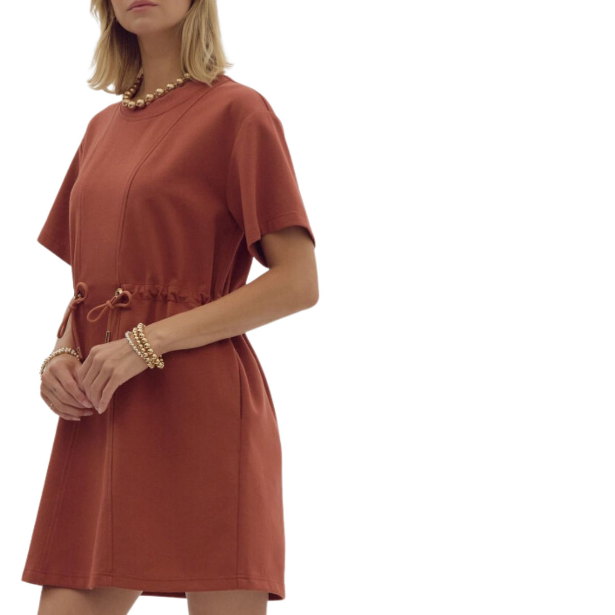 A woman stands wearing a FASHION GO Crew Neck Short Sleeve Cinched Waist Dress paired with pearl jewelry against a white background.