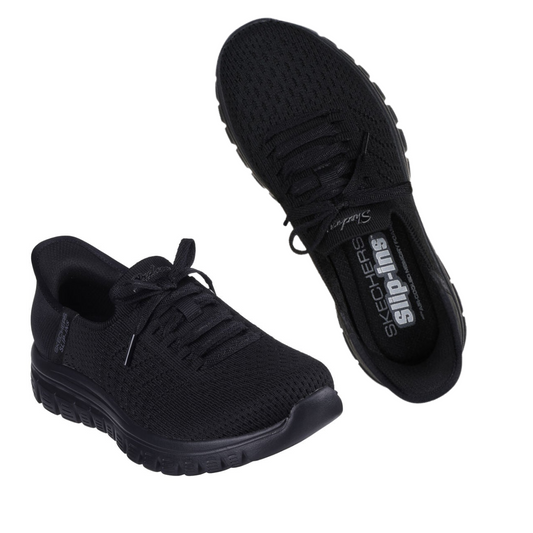 A pair of Graceful Slip Ins Tennis Shoes in black by Skechers USA Inc. One shoe is shown in a side view, and the other is displayed top-down. Both shoes feature a Stretch Fit knit upper, mesh details, and Air-Cooled Memory Foam insoles along with durable rubber soles.