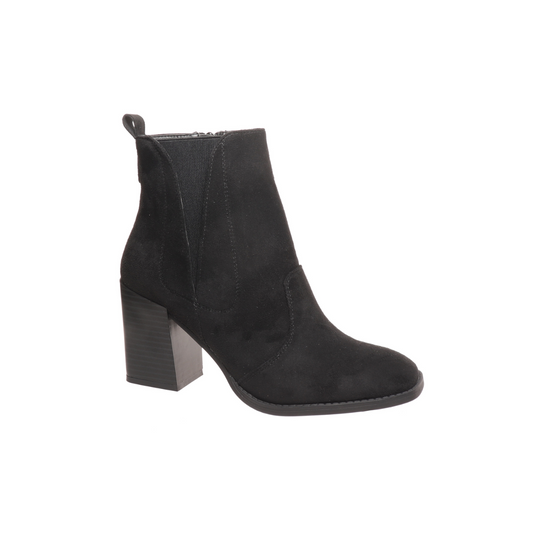 The Cammy-14 Boot in Black by Pierre Dumas from OLEM SHOE CORP makes a stylish statement with its faux suede finish, featuring a side zipper and a sturdy chunky block heel.