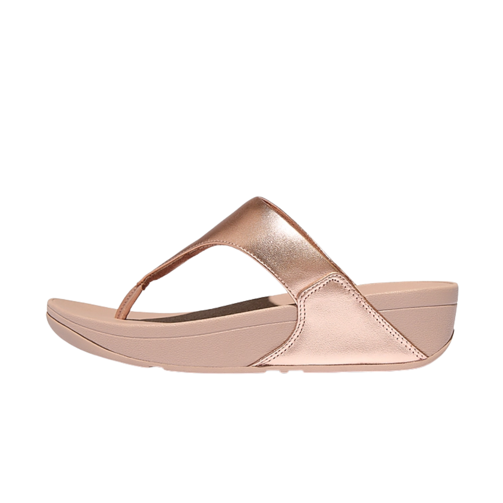 The FITFLOP USA LLC Lulu Leather Toe Post Thong Flip Flops in Rose Gold are shown in side profile, featuring a metallic leather finish and thick sole against a white background.