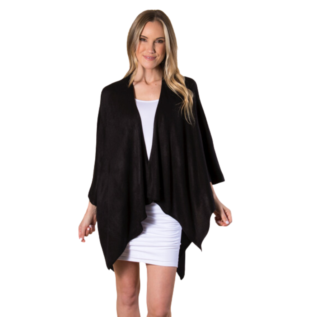 A woman in a white dress and the Cardi Wrap - Black by Ganz Inc stands against a white background, exuding an elegance that makes for a great gift. Main image