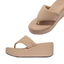 The Platfforms Wedge Flip-Flops by fit flop in Classic Beige feature a thick, wedge-like sole, CushX midsole, and cushioned footbed for all-day comfort. Shown from top and side views on a white background.