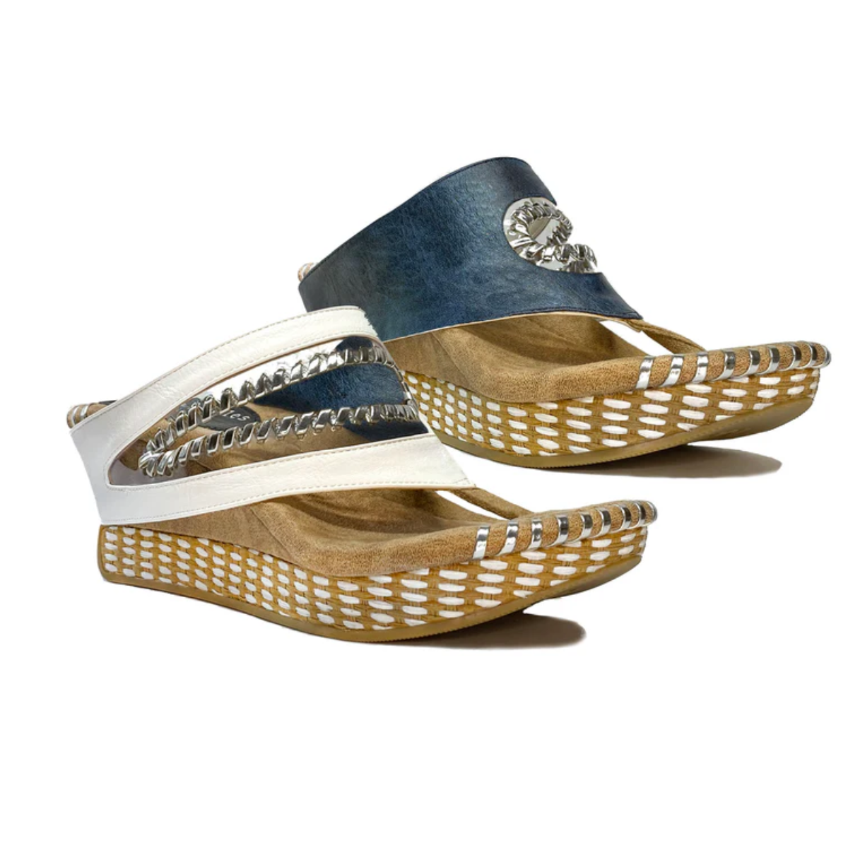 The Valencia #2 Navy and White Reversible Wedge by Modzori offers two stylish looks—versatile black and white or vibrant blue—with cutout designs and decorative stitching, ideal for those who love maximizing style options. Main image