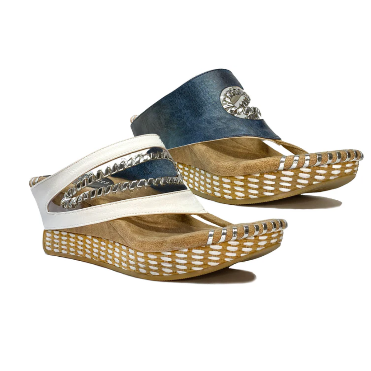 Introducing the Valencia Navy and White Reversible Wedge by MODZORI: slip-on wedge sandals featuring elegant braided strap detailing. The versatile design allows you to switch between a stylish navy or crisp white look. Complete with a tan footbed and woven-patterned sole, these 2-in-1 shoes are perfect for any occasion.