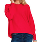 A woman wears the Zenana Viscose Front Seam Round Neck Sweater in bright red with blue jeans, standing against a plain white background.