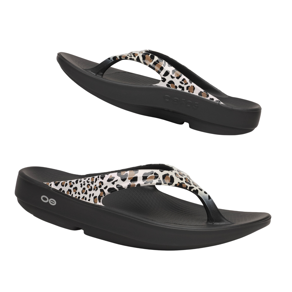 The OOFOS LLC Oofos Oolala Leopard Flip Flop features black, thick soles with an OOfoam footbed for arch support and leopard print-patterned straps, shown from side and angled top views on a white background.