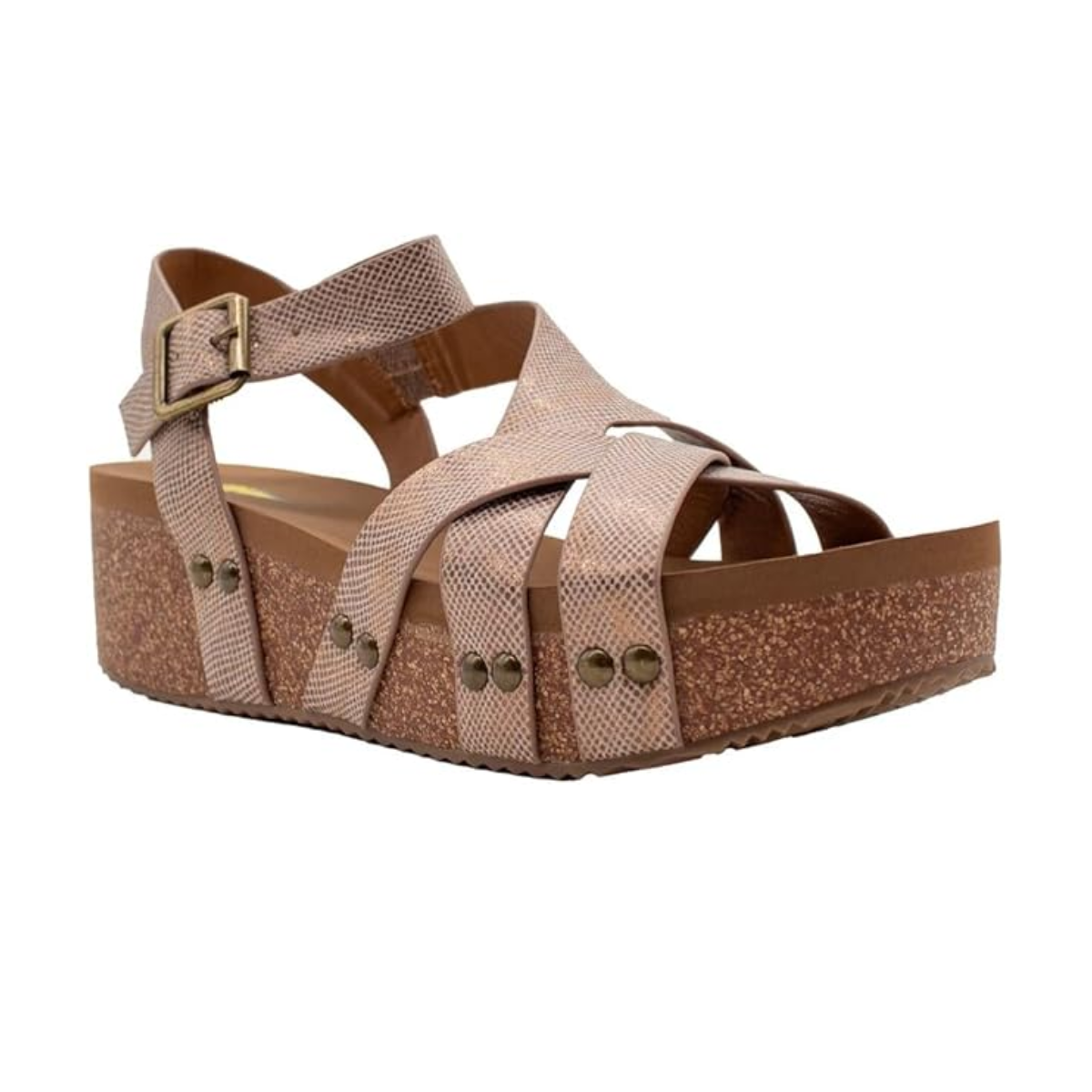 The Sandcastle Sandal by Volatile in Bronze features cross straps, buckle closure, and studded side details. Its thick, textured sole provides cushioned comfort and added height for all-day wear. Brand: Volatile - Rosenthal & Rosenthal.