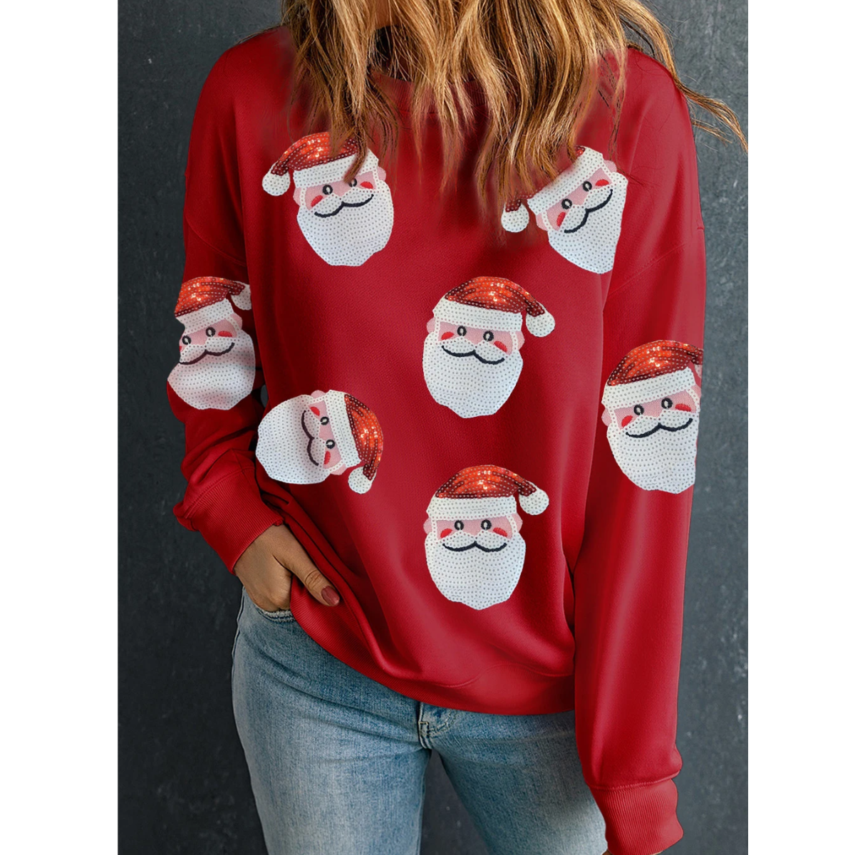 The person is dressed comfortably in a relaxed fit, wearing a Red Sequins Santa Clause Sweatshirt by Shewin, perfectly paired with blue jeans.