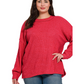 A woman in a Zenana Brushed Ribbed Hacci Drop Shoulder Sweater and blue jeans stands against a white background.