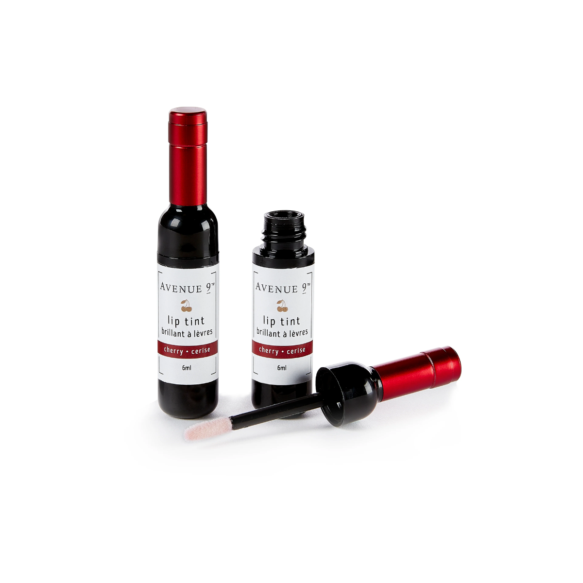 Two bottles of RED WINE LIP GLOSS by Avenue 9, one opened with an applicator wand laying beside it, the other unopened and standing upright—perfect as a stocking stuffer or party gift from GIFTCRAFT.