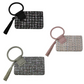 Introducing the "Tweed Cuff Handle Tassel Wristlet" by FASHION GO: a set of three stylish textured clutch pouches available in black, pink, and gray, each featuring chic tassels and elegant tweed cuff handles.