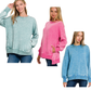 Three women wear FASHION GO Acid Washed Fleece Hi-Low Pullovers in pastel green, pink, and blue with jeans, standing against a white background.