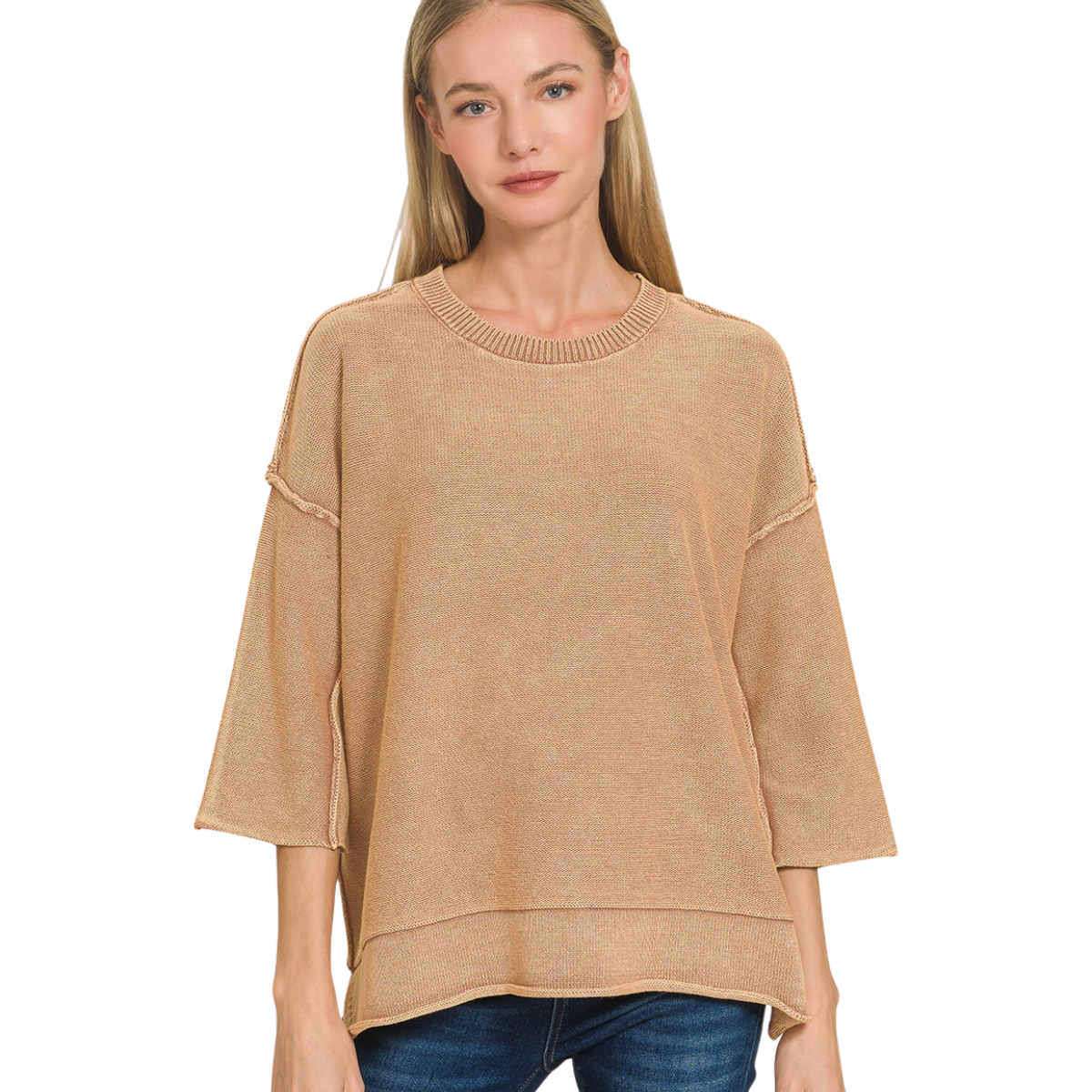 A woman with straight blonde hair wears the Zenana Washed 3/4 Sleeve Boxy Cotton Sweater in tan and blue jeans, standing against a white background.