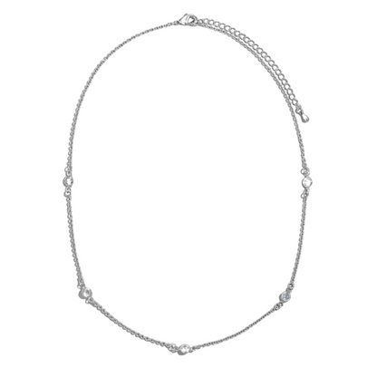 The Gold Dipped Station Chain Necklace by FASHION GO is a captivating piece, featuring small, evenly spaced cubic zirconia gems that add a touch of elegance to any outfit.