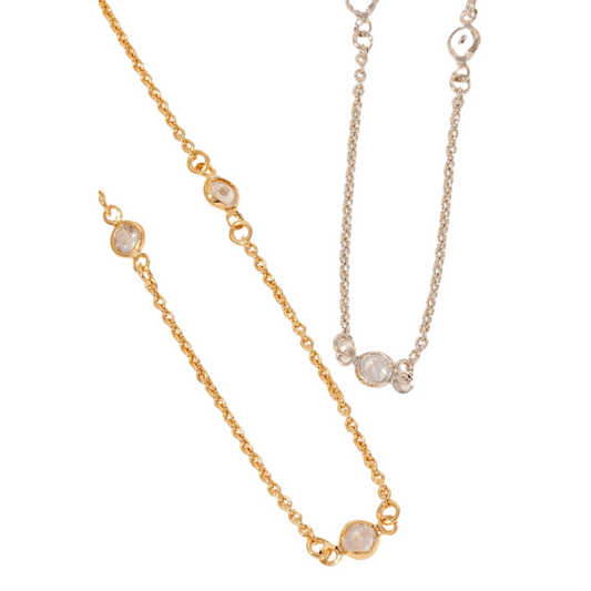 The Gold Dipped Station Chain Necklace by FASHION GO shimmers with circular crystal accents and cubic zirconia details against a white background.