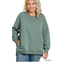 A woman models the Zenana Plus Fleece Hi-Low Sweatshirt with Pockets in ash jade green, styled with blue jeans against a white background.