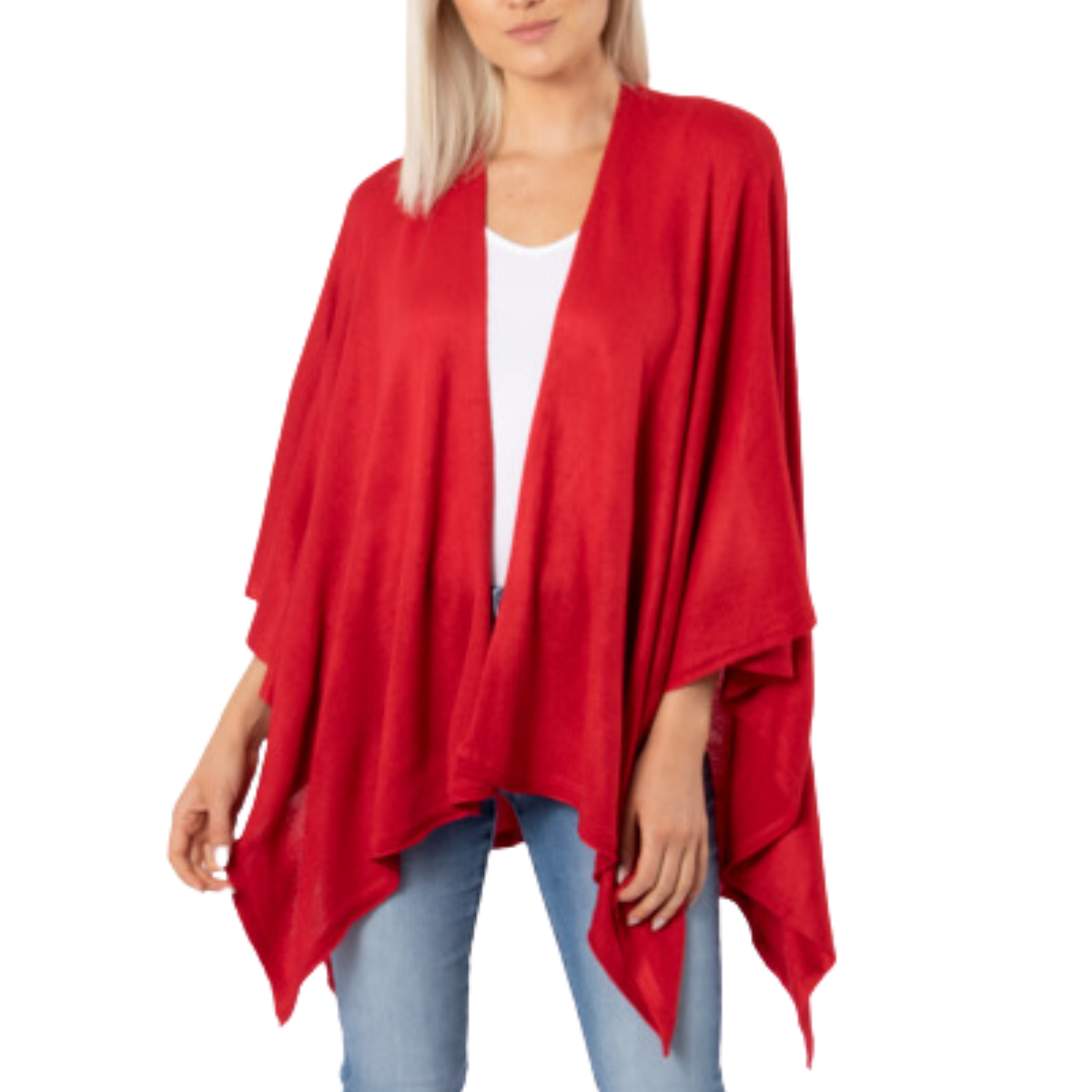 A person exudes elegance in the Cardi Wrap - Red by Ganz Inc, made of 100% acrylic, paired with a white shirt and blue jeans against a pristine white background.