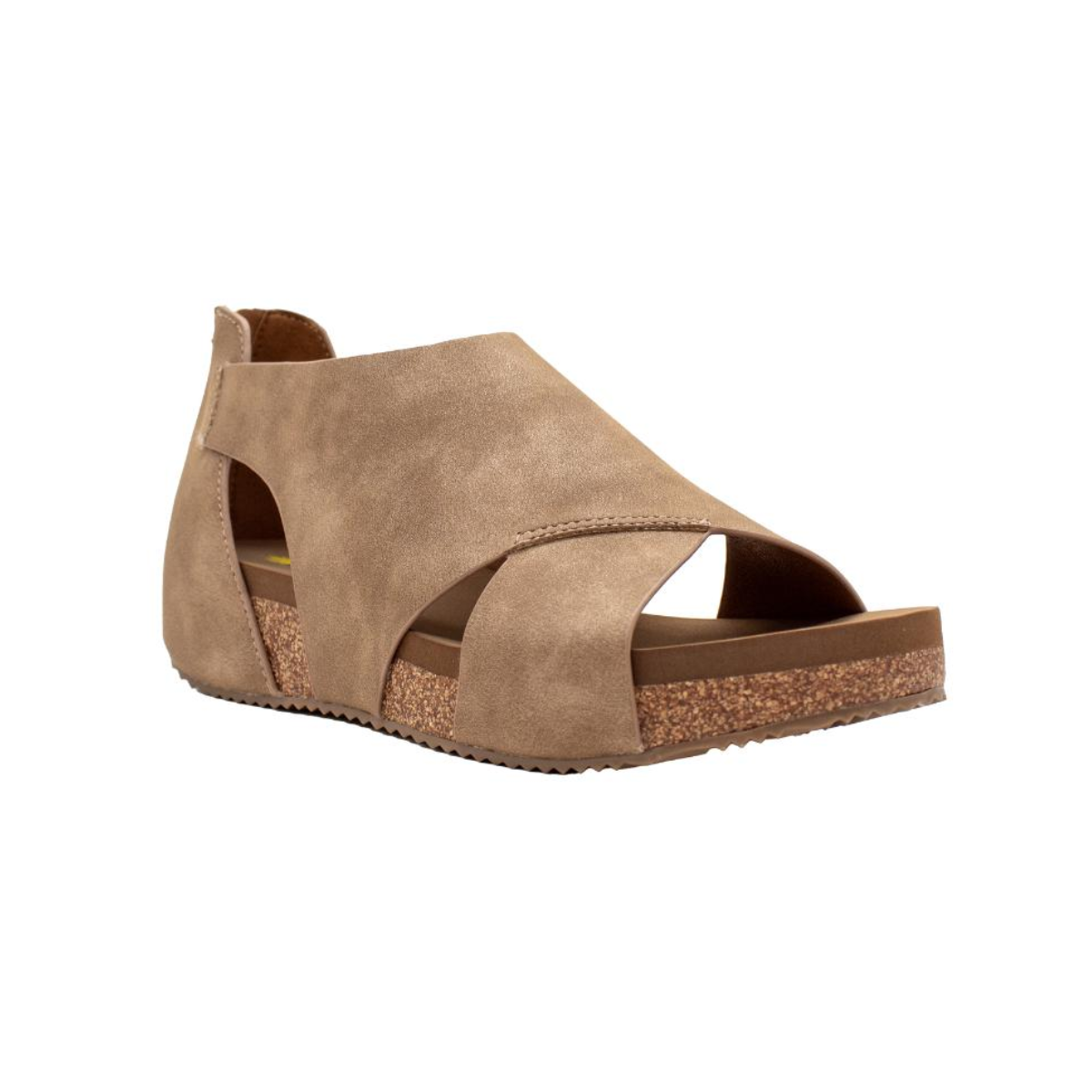 The Barstow Suede Sandal With Cutout Cognac by Volatile is a stylish cognac-colored open-toe sandal with a cork and rubber sole, featuring side cut-outs and a back strap, perfect for summer style.