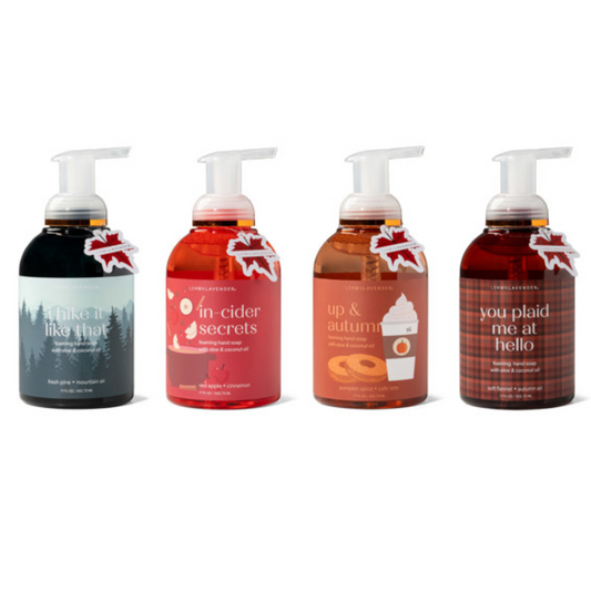 Four bottles of DM MERCHANDISING INC's Up & Autumn Foaming Hand Soap, each featuring a unique autumn-themed label and soothing ingredients, complete with a pump top.