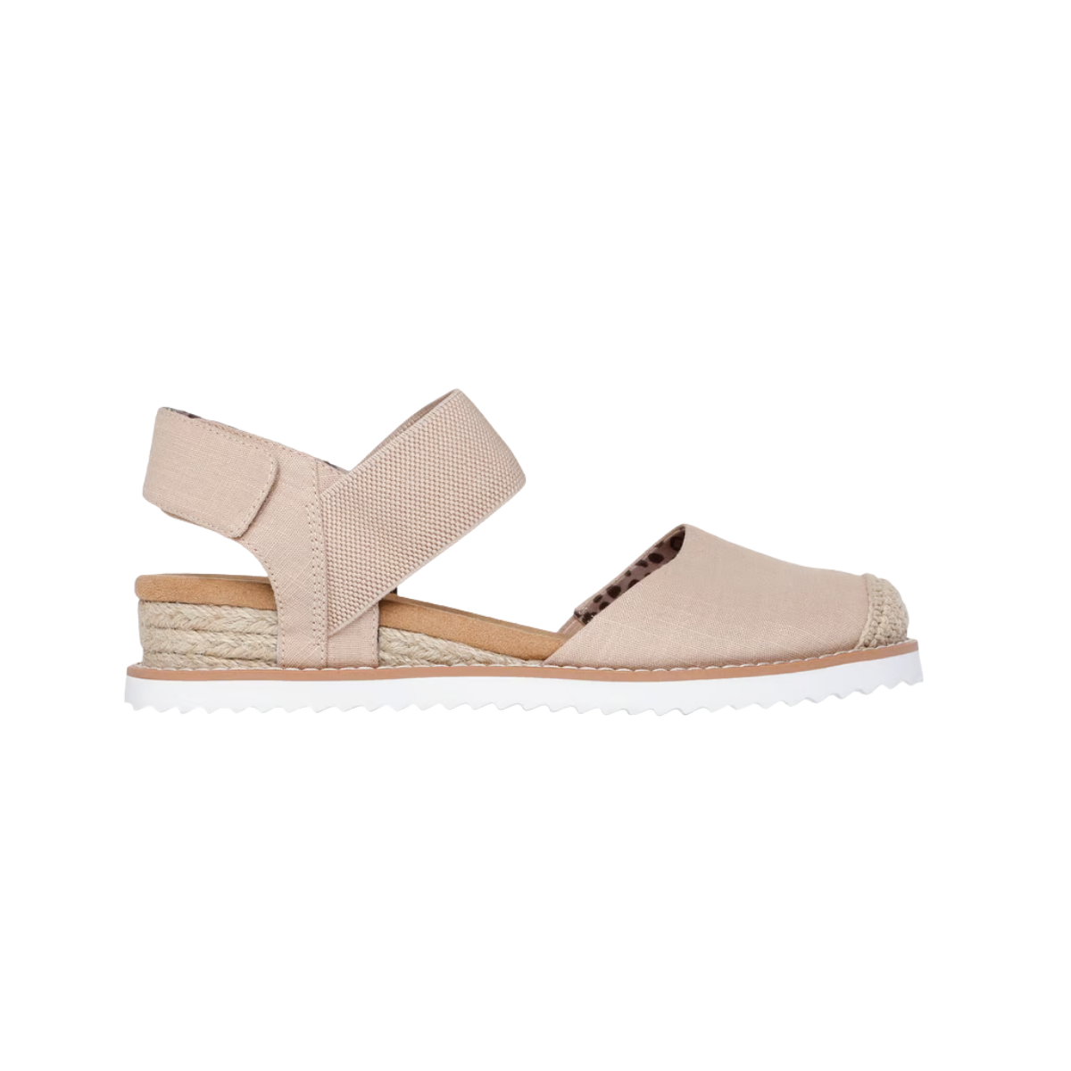 The Skechers Bobs Desert Kiss - Sun Shining by SKECHERS USA INC are beige vegan espadrille sandals with an open toe, elastic ankle strap, woven rope sole detail, and a white ridged outsole—shown in side profile.