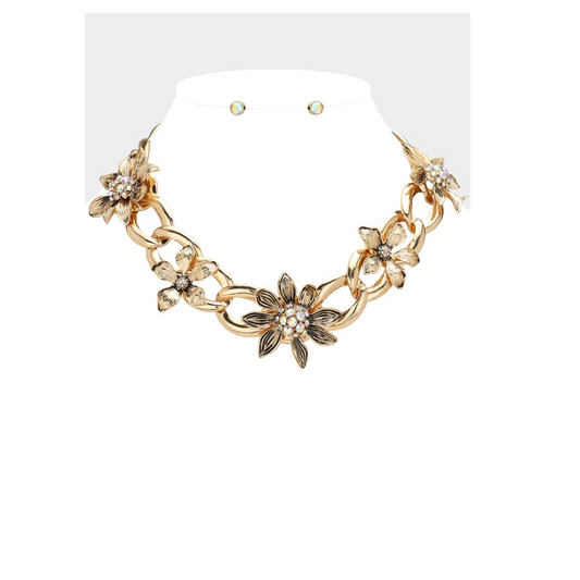 An exquisite Antique Metal Chunky Floral Necklace by FASHION GO, featuring intricate stone-paved flower designs, paired with a set of elegant stud earrings.