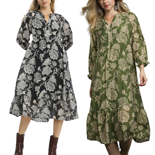 Two women wear Umgee Floral Print Boho Midi Dresses—one in black and white, the other in olive green and beige—both with a loose fit and tiered hem for a chic, boho-inspired look.