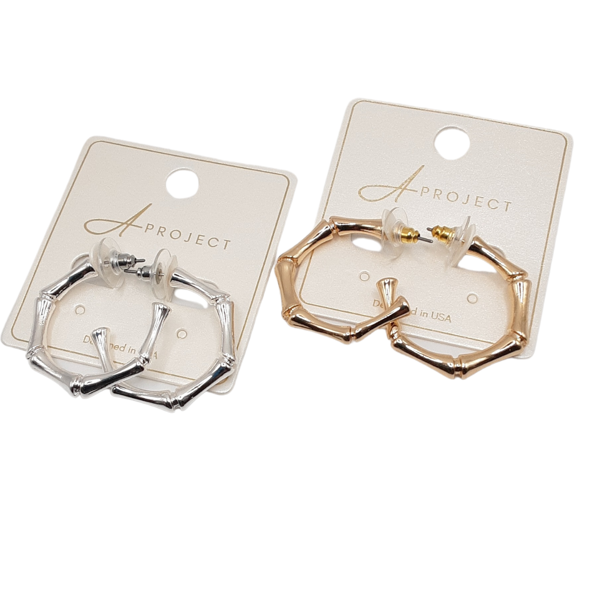Two pairs of Bamboo Look Hoops from SPECIAL EFFECTS, each with a 1 1/4" diameter, are elegantly displayed on cards: one in shimmering silver and the other in radiant gold. Main image