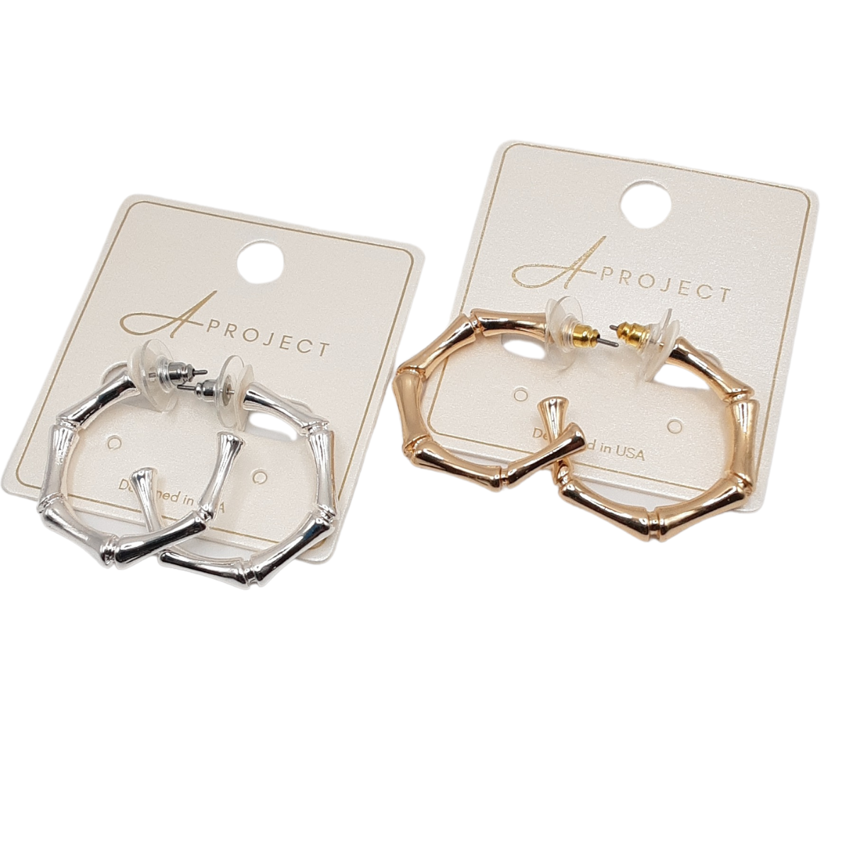 Two pairs of Bamboo Look Hoops from SPECIAL EFFECTS, each with a 1 1/4" diameter, are elegantly displayed on cards: one in shimmering silver and the other in radiant gold.