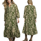 A woman models the Umgee Floral Print Boho Midi Dress in olive green and beige, shown from front and back. She pairs it with brown boots for a complete boho look.