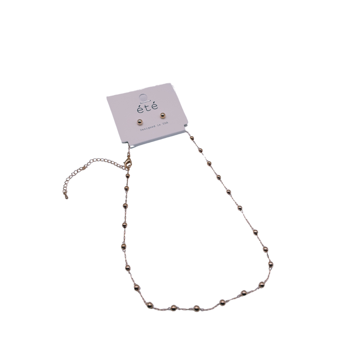The Gold 16" 3mm Beads Set by SPECIAL EFFECTS includes a delicate necklace with a chain extension and matching stud earrings, all featuring 3mm beads, elegantly presented on a branded card. Main image