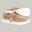 The Paulie Kids Shoe in Khaki by LAMO boasts durable beige canvas with textured fabric, white speckled soles, and light brown toggle fasteners. Ideal on gray backgrounds, they offer comfort with cushioned insoles.