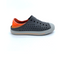 The Kids Skechers Guzman Foamies in Charcoal by SKECHERS USA INC features a dark gray perforated upper, gray sole, and orange heel with Nano Lite foam comfort—shown as a single casual shoe on a white background.