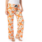 The person is comfortably dressed in Hello Mello Lounge Pants Spring Edition by DM Merchandising Inc, featuring ultra-soft orange fabric with a charming white daisy pattern and an elastic waistband, seamlessly paired with a plain white shirt.