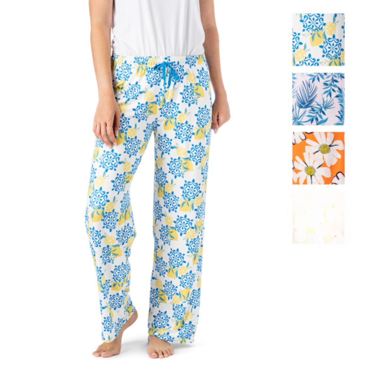 A person wears Hello Mello Lounge Pants Spring Edition by DM MERCHANDISING INC, showcasing an elastic waistband and a white base with blue and yellow floral prints. The image includes various floral swatches, emphasizing the soft, stretchy fabric of these cozy pants. Main image