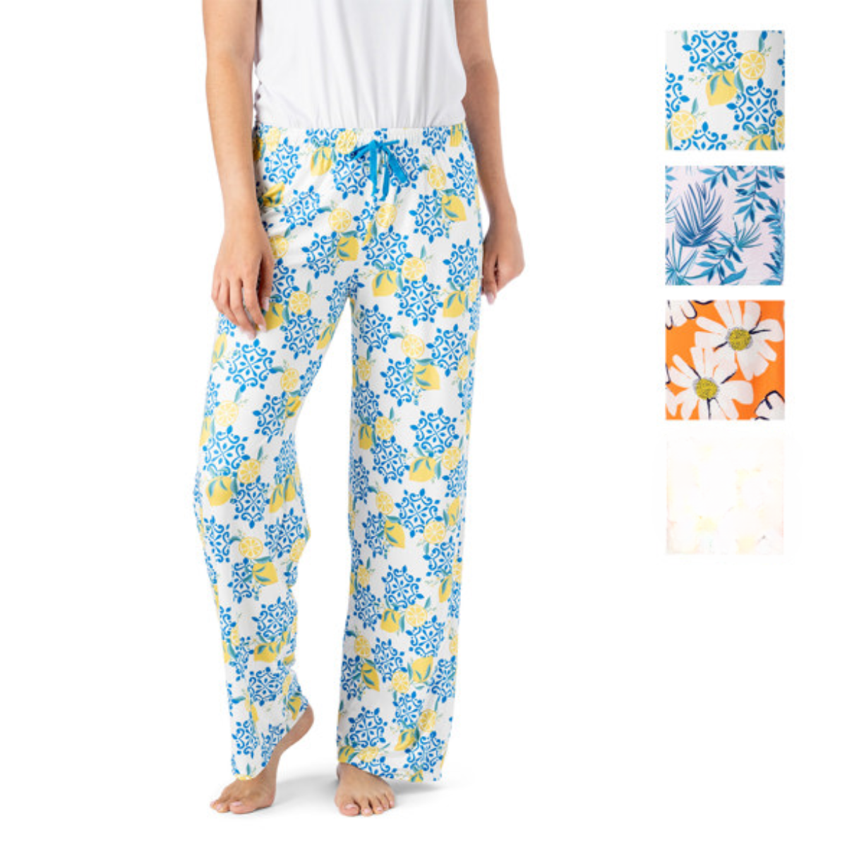 A person wears Hello Mello Lounge Pants Spring Edition by DM MERCHANDISING INC, showcasing an elastic waistband and a white base with blue and yellow floral prints. The image includes various floral swatches, emphasizing the soft, stretchy fabric of these cozy pants.