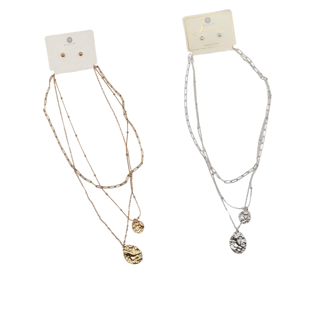Two sets of SPECIAL EFFECTS necklaces with earrings on display cards: the left features gold-tone layered chains and earrings, while the right showcases silver with textured pendants and coin accents, contrasting delightfully with hammered metal finishes. Main image