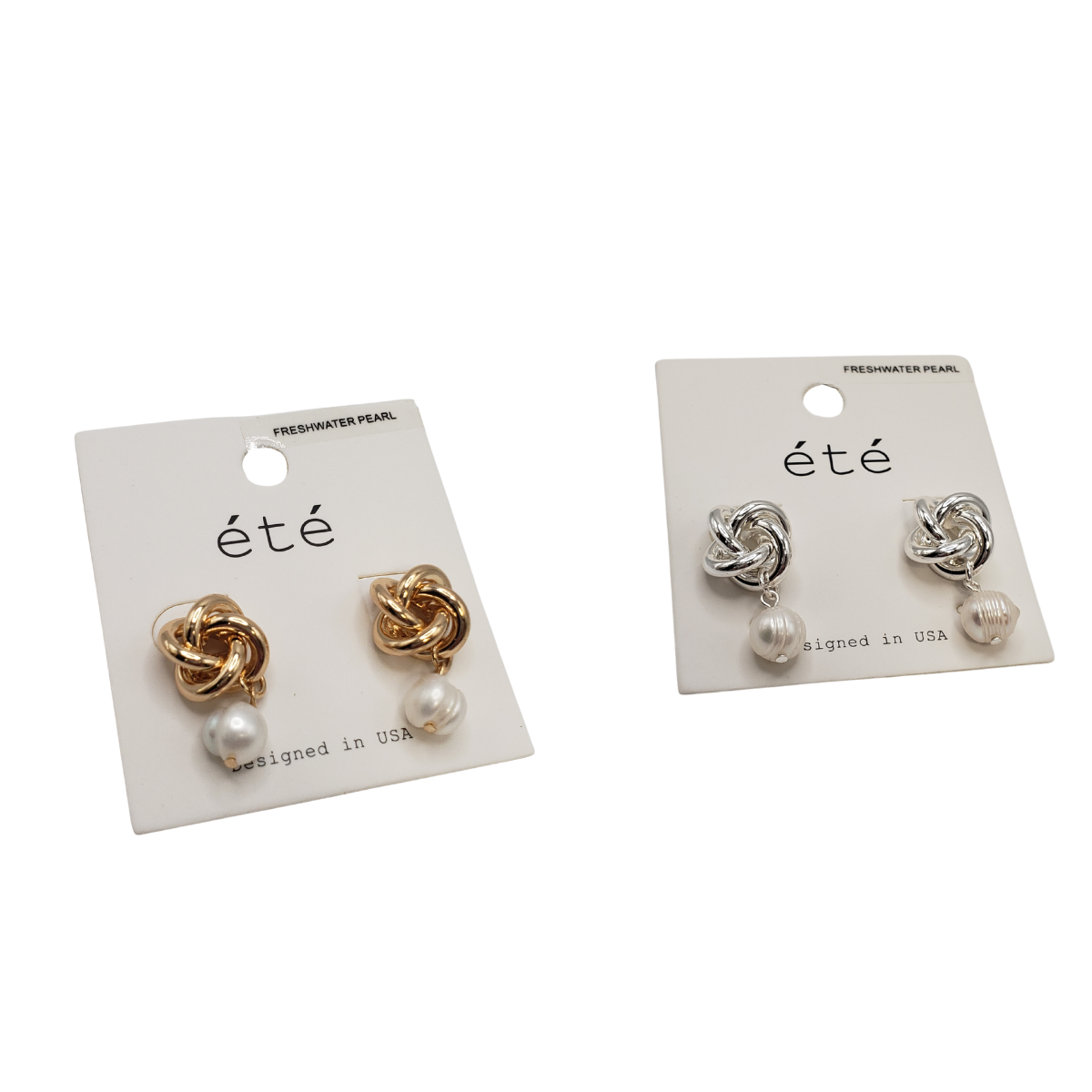 Two pairs of "été" carded stud earrings from SPECIAL EFFECTS, featuring elegant gold and silver love knot designs, each adorned with a dangling freshwater pearl. Main image