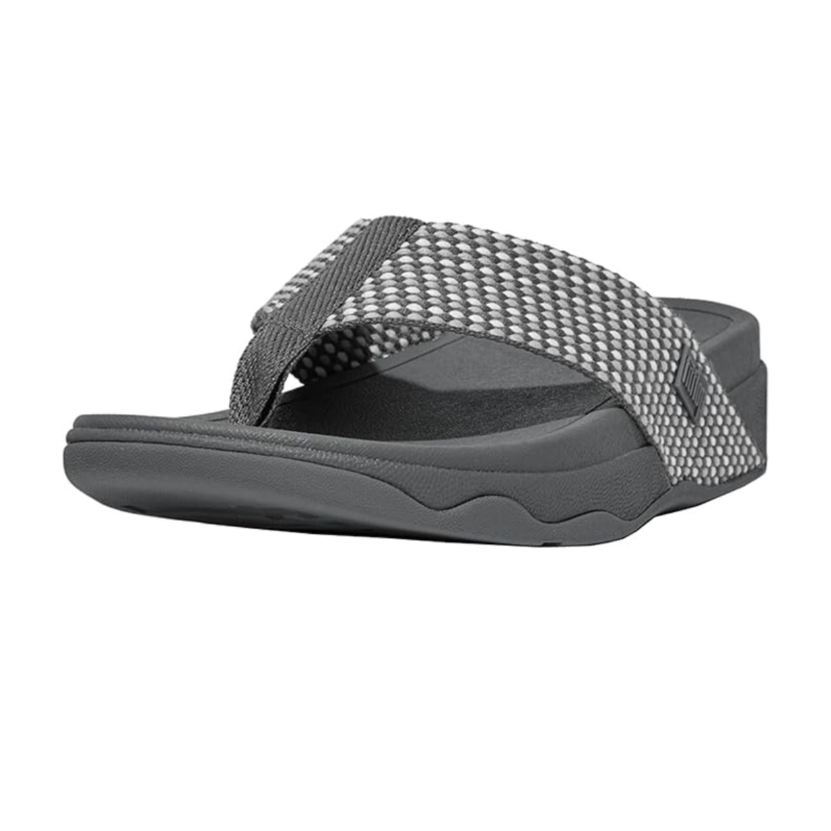 The Surfa Women's Flip Flop by FIT FLOPS in Pewter, from FITFLOP USA LLC, features a textured strap and a super-cushioned midsole for long-lasting comfort, as seen from the front left side.