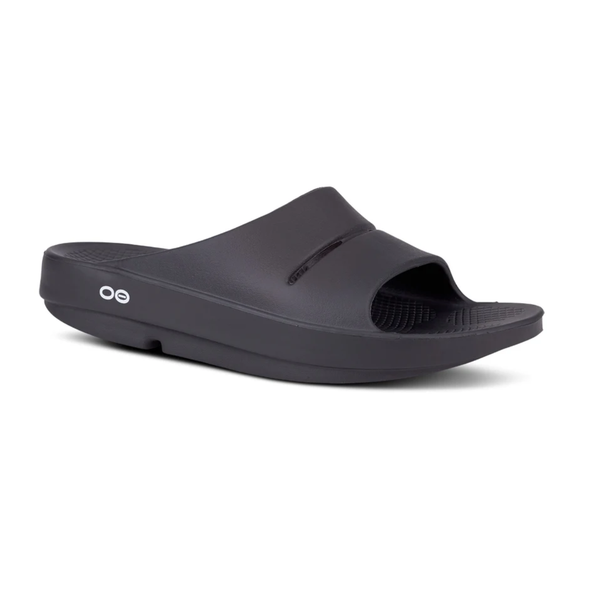 Displayed against a white background, the OOFOS Ooahh Men's Slide by OOFOS LLC is a black slip-on sandal with a thick sole, open toe design, and patented footbed for optimal comfort.