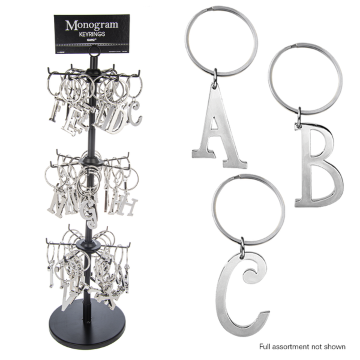 Ganz Inc's display stand features INITIAL KEY CHAIN items, showcasing metal keyrings shaped like the alphabet with separate displays for letters A, B, and C. Main image