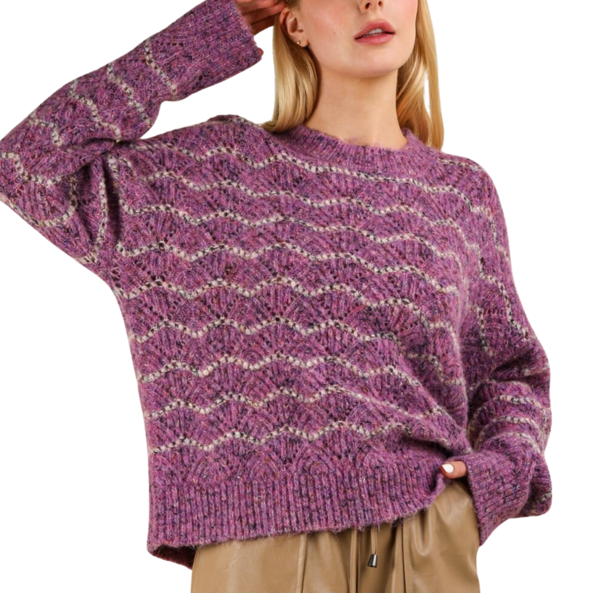 A person wearing a Fashiongo ECO Wave Striped Soft Knit Pullover Sweater Top in purple and gray, paired with beige pants.